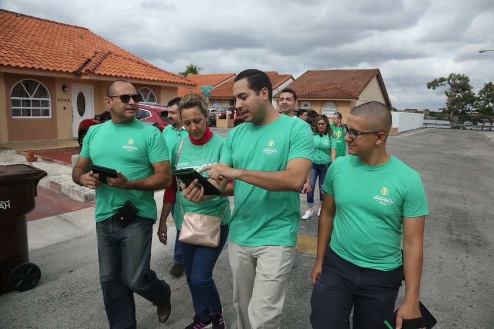 Grassroots activists with Americans for Prosperity go door to door in their Florida neighborhood.